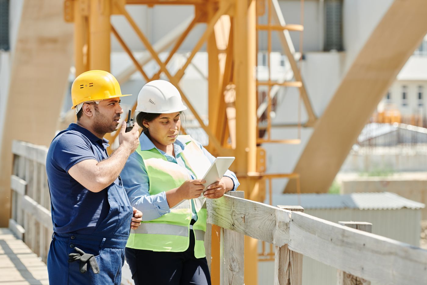 Site engineers reviewing project data on a tablet